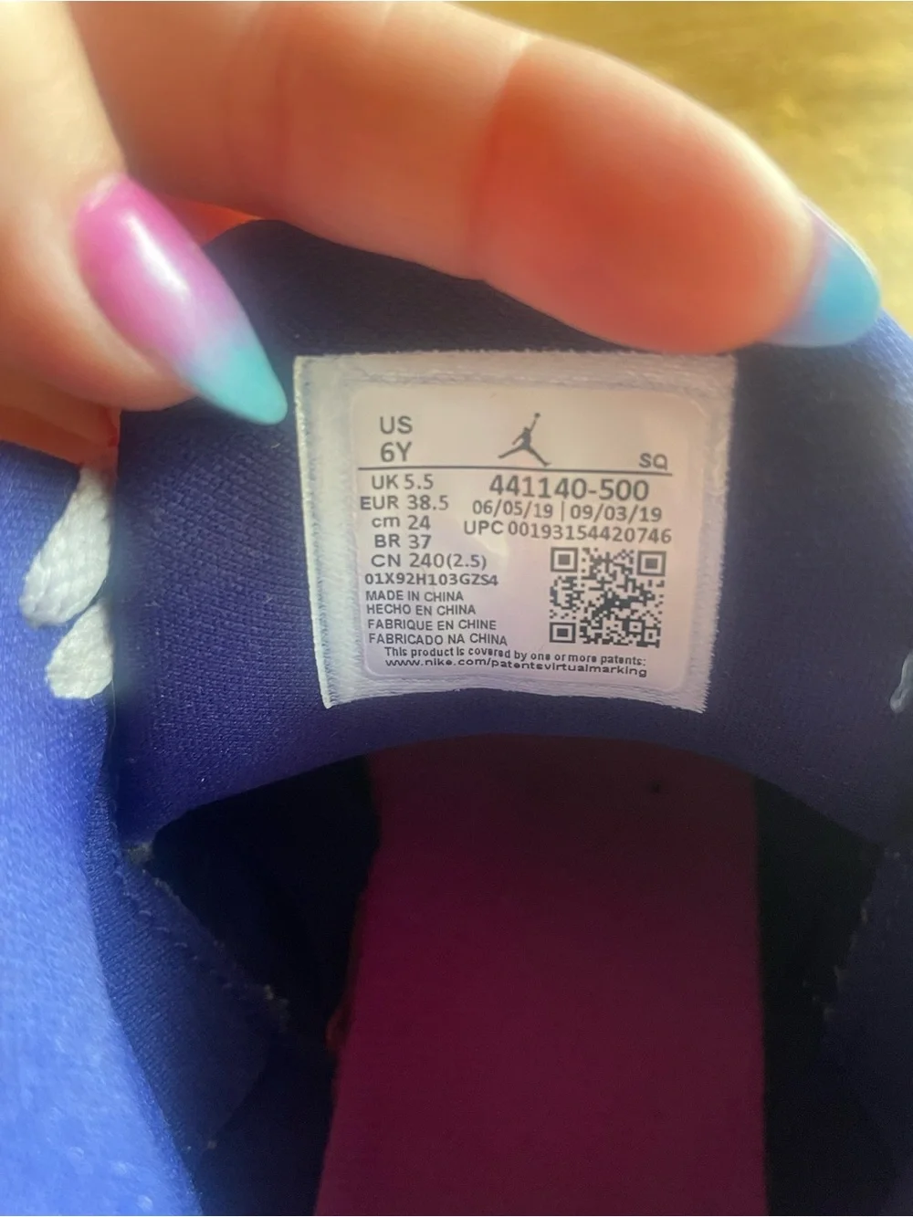 Nike Kids White Sneakers with Pink and Purple Accents